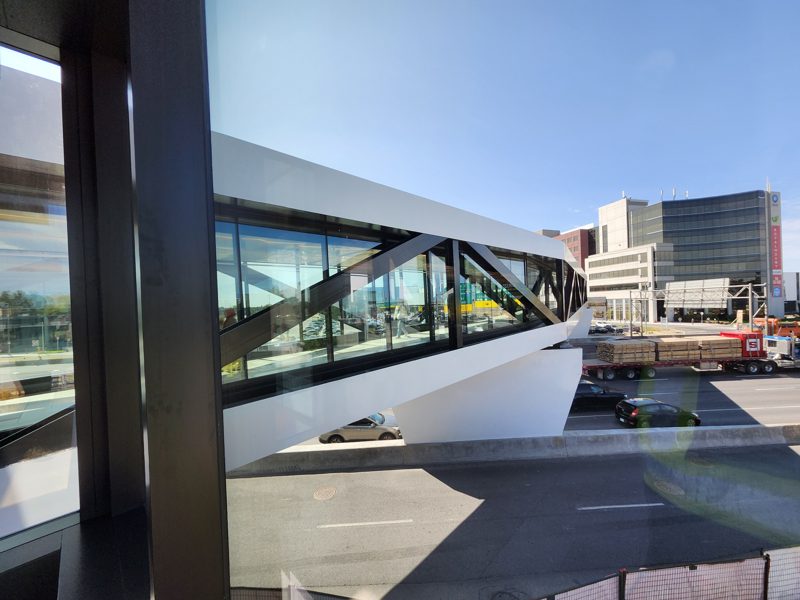 The Royalmount pedestrian bridge, glass and white steel